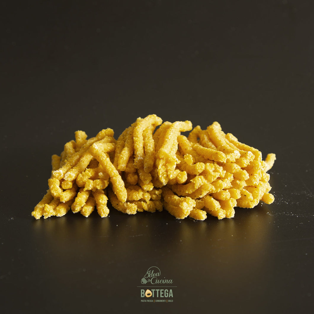 Passatelli asciutti con crema di parmigiano, brunoise di zucca e caviale di aceto balsamico
